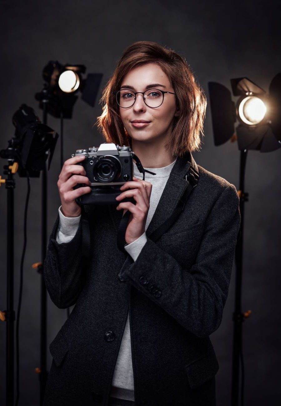 beautiful-redhead-female-photographer-holds-a-digi-2023-11-27-04-51-54-utc (1)