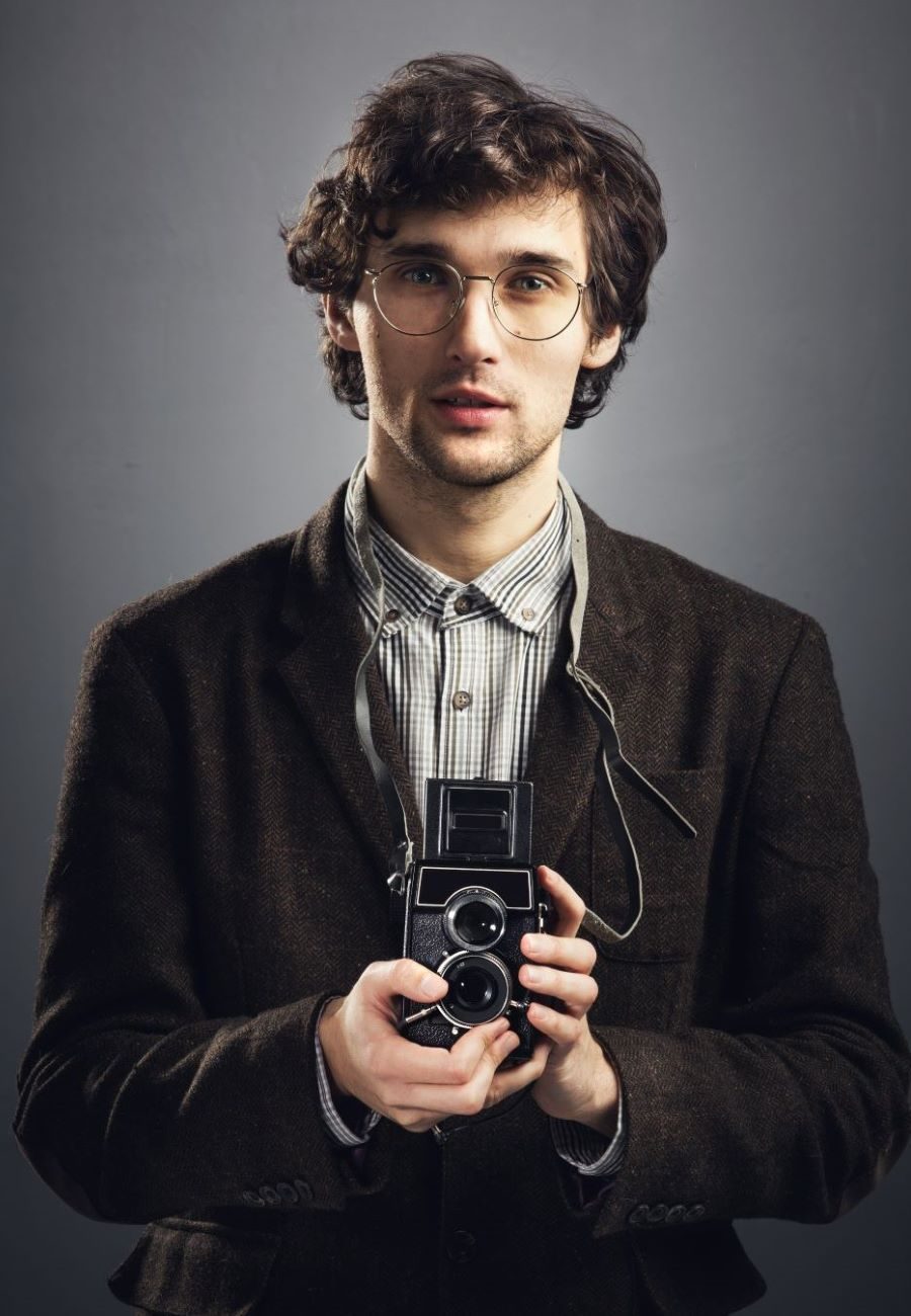 man-in-vintage-suit-with-retro-camera-2023-11-27-05-33-22-utc (1)