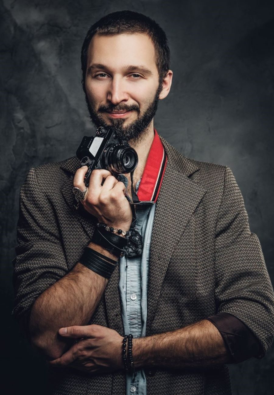 man-is-posing-for-photographer-with-photo-camera-2023-11-27-05-20-06-utc (1)